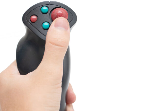 Hand holding joystick during calibration process.